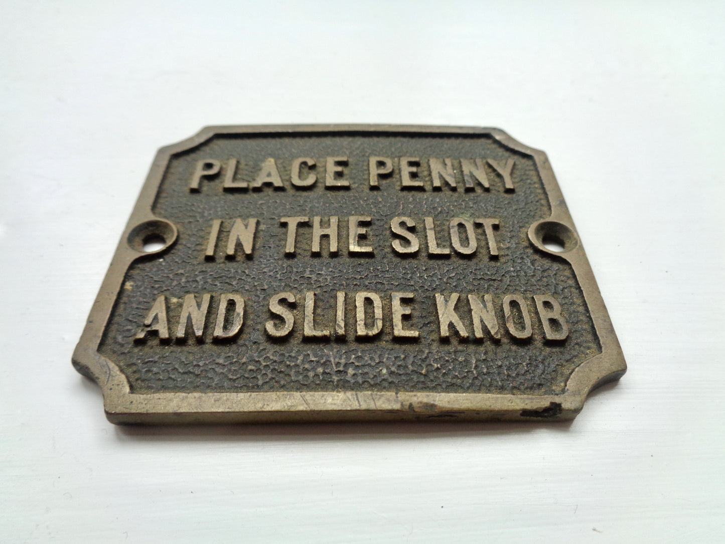 Vintage Brass Instruction Sign To Place Penny In The Slot and Slide Knob