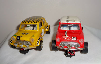 Pair of Scalextric C7 Rally Mini Coopers: Red With White Roof and Yellow With Black Chequered Roof