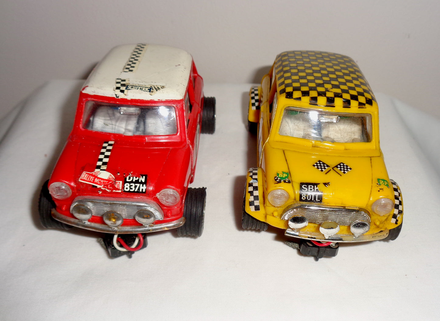 Pair of Scalextric C7 Rally Mini Coopers: Red With White Roof and Yellow With Black Chequered Roof