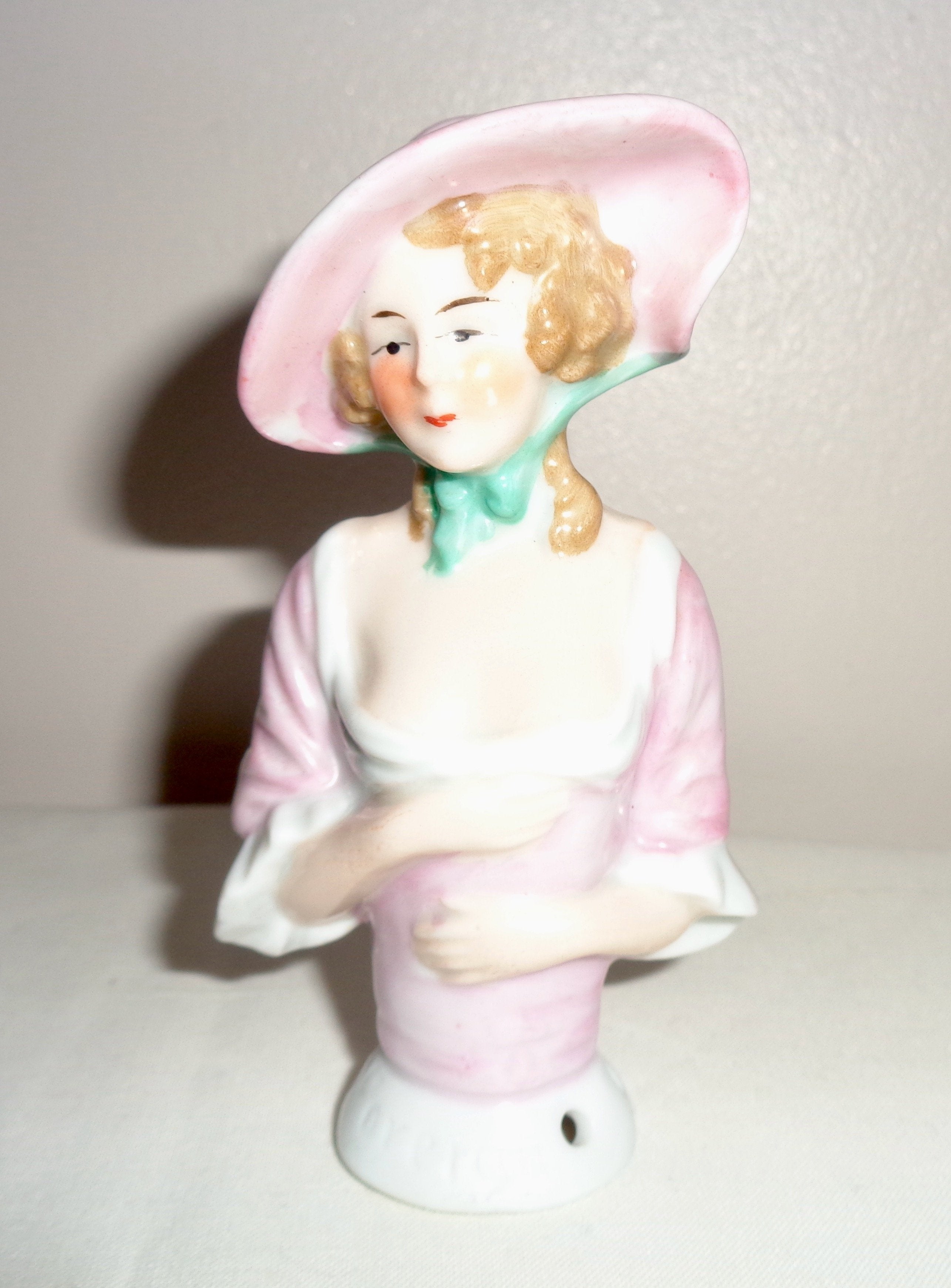 Porcelain half doll pin cushion top Woman with Georgian hairstyle and lovely high quality hat Marked 'Foreign' Hand painted